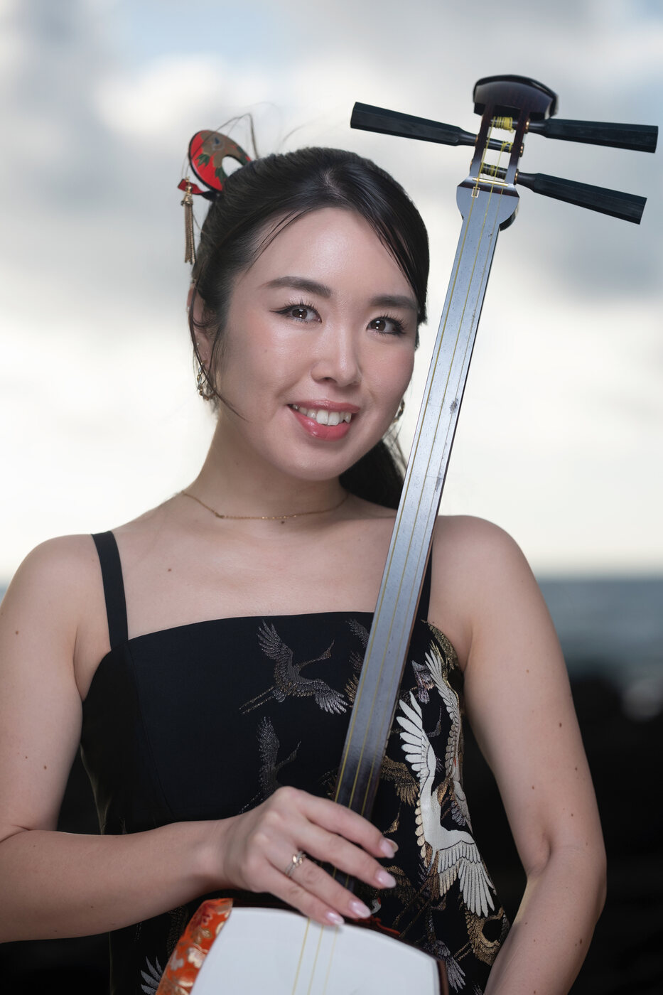 Anju Madoka holding shamisen